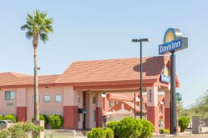 a fast food restaurant with a sign in front of it at Days Inn by Wyndham Tucson Airport in Tucson