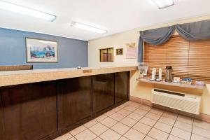 a waiting room at a hospital with a counter at Days Inn by Wyndham El Paso Airport East in El Paso