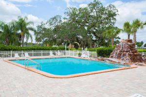 a swimming pool in a resort with a water park at Days Inn by Wyndham Brooksville in Brooksville