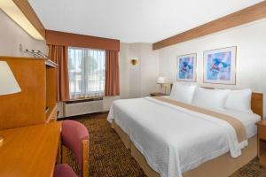 Cama o camas de una habitación en Days Inn by Wyndham Liberal KS