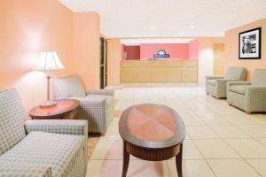 a waiting room at a hospital with chairs and a table at Days Inn by Wyndham Hattiesburg MS in Hattiesburg +12 photos