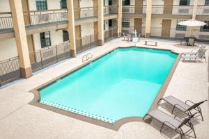 an overhead view of a swimming pool at a hotel at Days Inn by Wyndham Houston in Houston