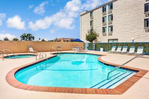 The swimming pool at or close to Days Inn & Suites by Wyndham Fullerton