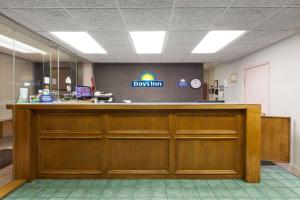 a dispatch counter in a waiting room at Days Inn by Wyndham Norman in Norman