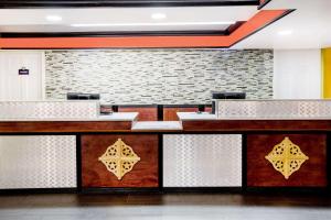 a lobby of a restaurant with a reception desk at Days Inn by Wyndham Little Rock/Medical Center in Little Rock
