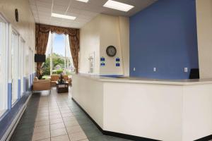 a hallway of a hospital with a waiting room at Days Inn by Wyndham - Cape Cod in West Yarmouth