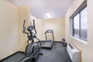 a gym with two exercise bikes and a window at Days Inn by Wyndham Baytown East in Baytown