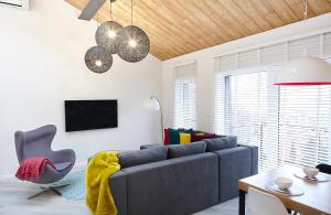 Televízia a/alebo spoločenská miestnosť v ubytovaní Apartament Sun House SAUNA KOMINEK SKRZYCZNE