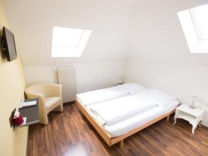 Ένα ή περισσότερα κρεβάτια σε δωμάτιο στο Hotel Gregory