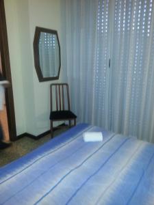 Postel nebo postele na pokoji v ubytování Hotel Lombardia