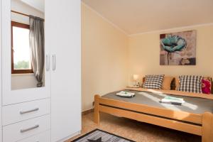 Postel nebo postele na pokoji v ubytování Apartment Oli