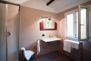 Postel nebo postele na pokoji v ubytování Boutique Hotel Albero Nascosto