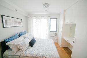 Katil atau katil-katil dalam bilik di New York Suite at Oasis +18 gambar