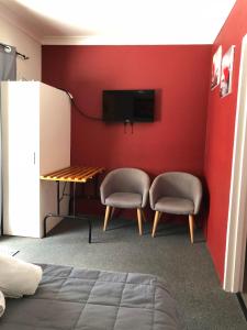 TV a/nebo společenská místnost v ubytování Motel Lodge