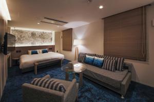 Posteľ alebo postele v izbe v ubytovaní Hotel Code Shinsaibashi
