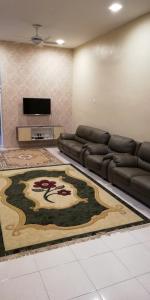 Posezení v ubytování Hazim Homestay Changlun Pakej Esklusif