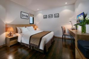 Postel nebo postele na pokoji v ubytování Hanoi Paon Hotel & Spa