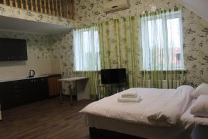 A bed or beds in a room at Апартаменти Рилєєва, 25