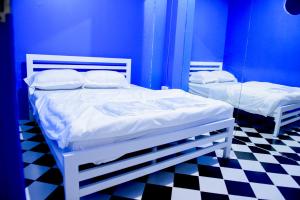 Cama o camas de una habitación en OYO 783 Brunch Marker Cafe & Hostels