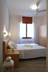 Postelja oz. postelje v sobi nastanitve Appartamenti Diplomatic-Residence Fronte mare-Piazza Torino-Lido di Jesolo