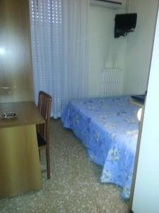 Postel nebo postele na pokoji v ubytování Hotel Lombardia