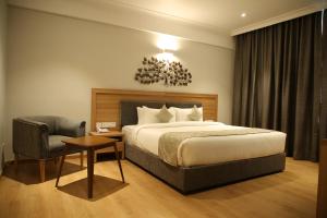 Ein Bett oder Betten in einem Zimmer der Unterkunft Native INN By Heda Hospitality
