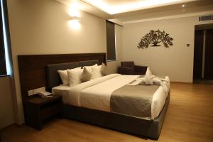 Ein Bett oder Betten in einem Zimmer der Unterkunft Native INN By Heda Hospitality