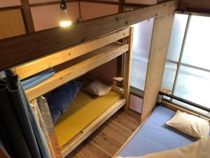 Postel nebo postele na pokoji v ubytování Fujiya + 2 fotografie