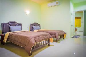 Cama o camas de una habitación en Palm Kaew Resort Krabi