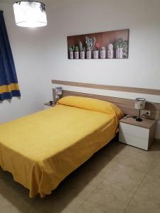 Postel nebo postele na pokoji v ubytování Complejo Turistico la Pinada
