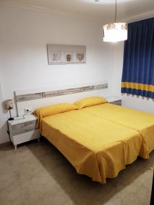 Postel nebo postele na pokoji v ubytování Complejo Turistico la Pinada