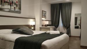 Postel nebo postele na pokoji v ubytování Coccodrillo Hotel & Apartments