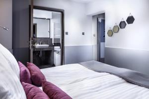 En eller flere senge i et værelse på Hotel Cristal Park