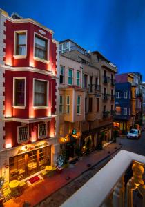 a group of buildings in a city at night at Amofta Hotel Taksim in Istanbul