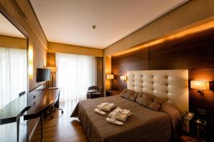 Säng eller sängar i ett rum på Nafs Hotel