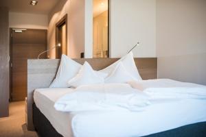 Posteľ alebo postele v izbe v ubytovaní Boutiquehotel Minigolf