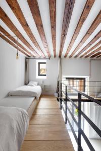 A bed or beds in a room at Don Pedro Home