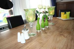 a table with several wine glasses and flowers on it at Hotel Albion in Scheveningen