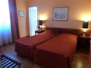Postel nebo postele na pokoji v ubytování Hôtel Restaurant Erckmann Chatrian