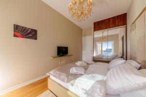 Postel nebo postele na pokoji v ubytování Hotel Tre Canne