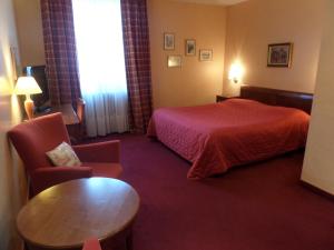 Postel nebo postele na pokoji v ubytování Hôtel Restaurant Erckmann Chatrian