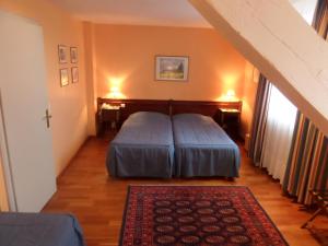 Postel nebo postele na pokoji v ubytování Hôtel Restaurant Erckmann Chatrian