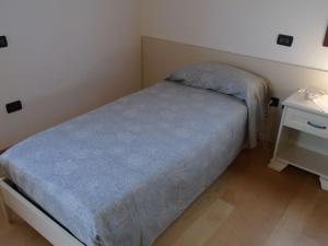 A bed or beds in a room at B&B Ai Cipressi