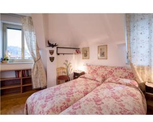 a bedroom with a bed and a window at Luna sui tetti in Santa Margherita Ligure