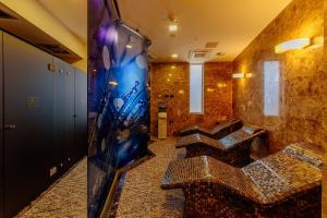 TV a/nebo společenská místnost v ubytování Hotel Tre Canne