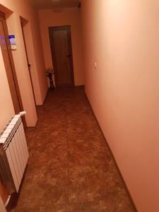 an empty hallway of a room with a hallway at Guest House Iveta in Sofia