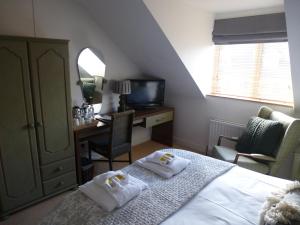 Ένα ή περισσότερα κρεβάτια σε δωμάτιο στο Grove Bed & Breakfast