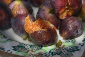a plate of figs with a piece of food on it at The Pyramid Lofts in Cairo
