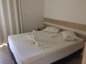 Postel nebo postele na pokoji v ubytování Apart Canoa Quebrada
