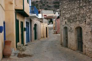an alley in an old town with buildings at Traditional House in Elounda in Elounda